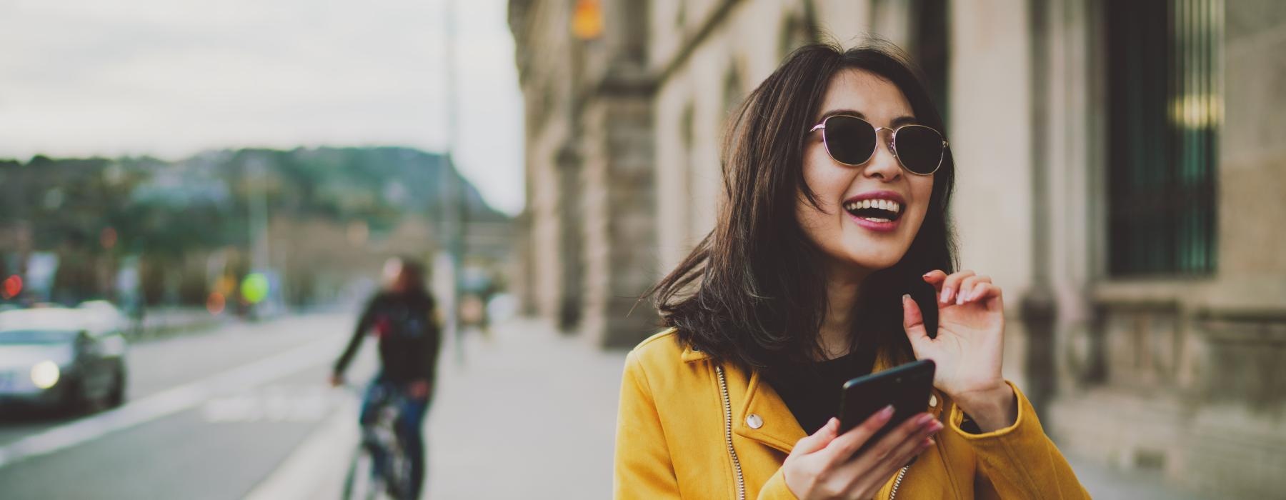 a woman holding a phone