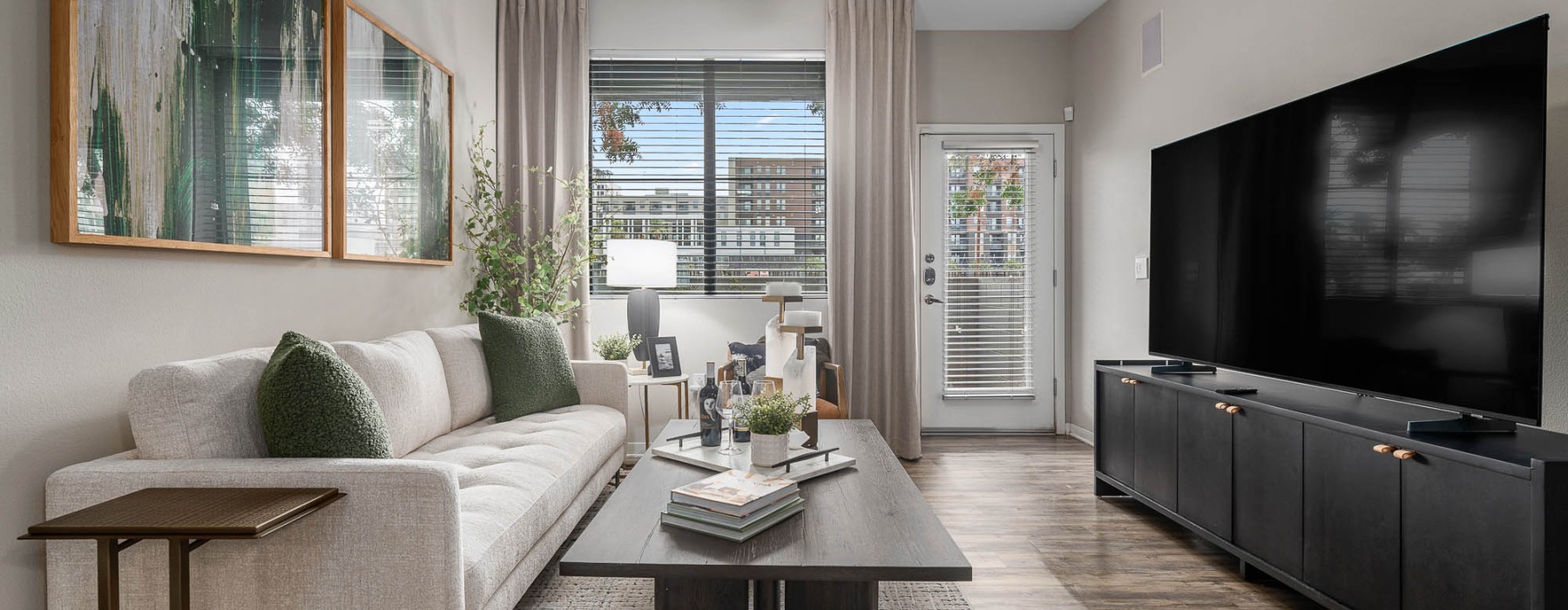 a living room with a tv and couches