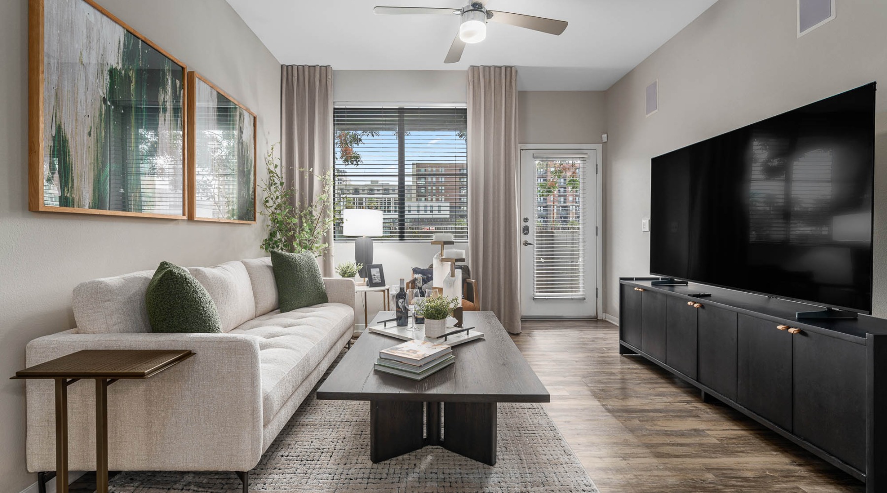 living room with a large window and open spaces