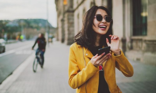 a woman holding a phone