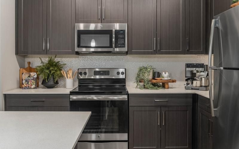 a kitchen with black appliances