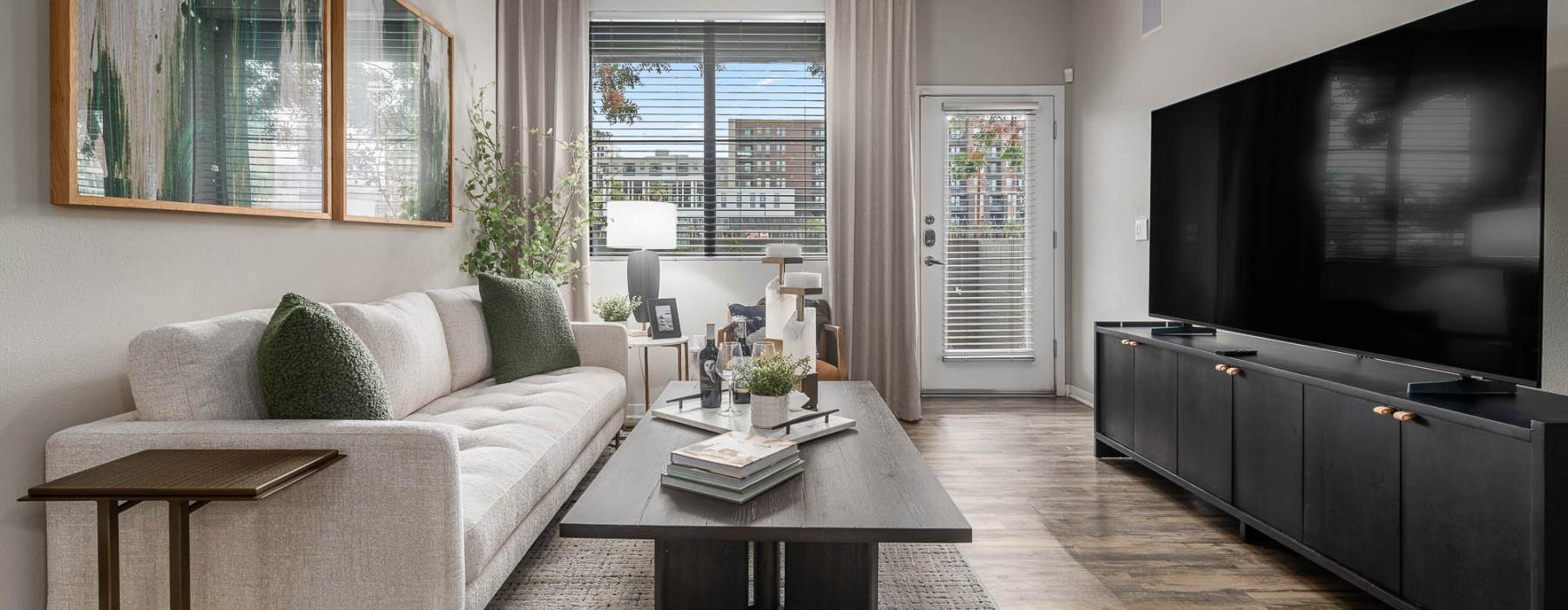 a living room with a tv and couches